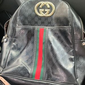 Used black and gold real Gucci backpack